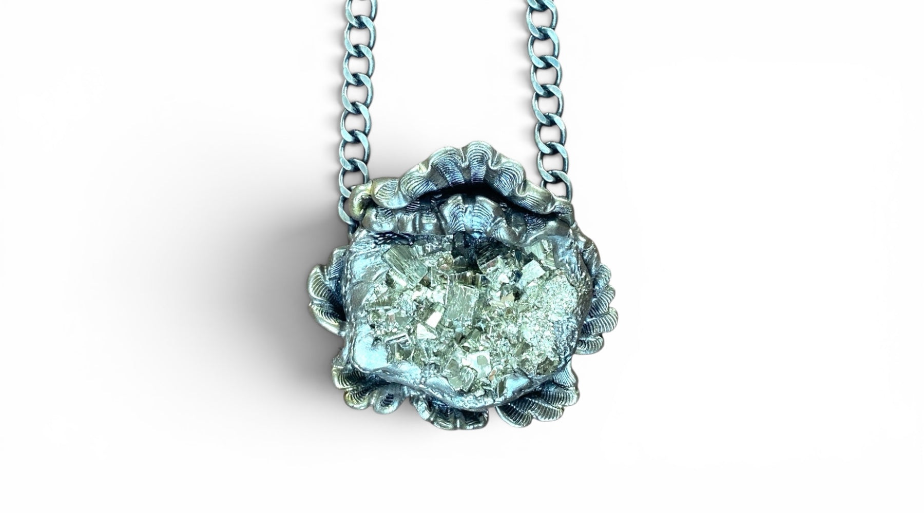 Silver  sculpted flower necklace with pyrite center